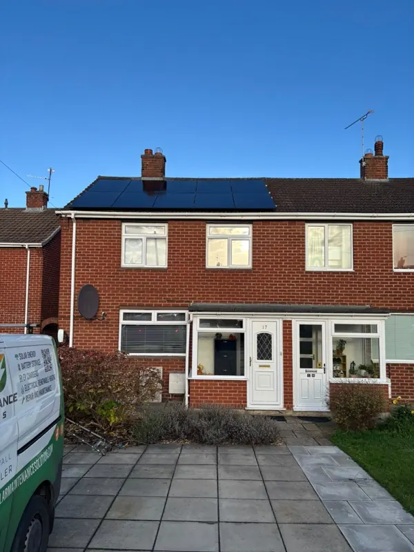 Black solar panels on the roof of a semi-detached home, fitted by SMS